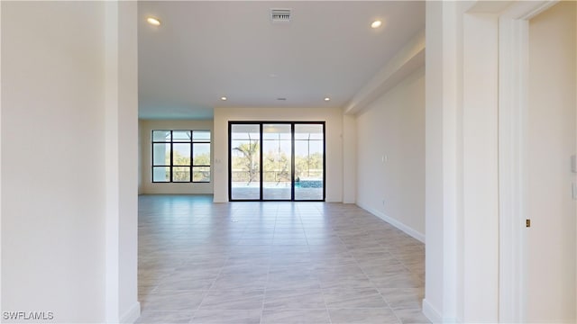 unfurnished room featuring light tile patterned floors