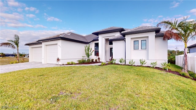 view of front facade with a garage and a front lawn