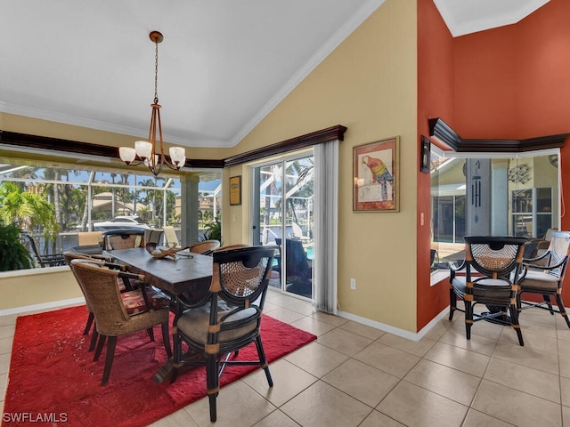 tiled dining room with crown molding, high vaulted ceiling, and a notable chandelier