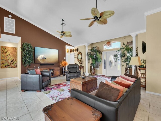 living room featuring crown molding, ceiling fan, light tile floors, and ornate columns
