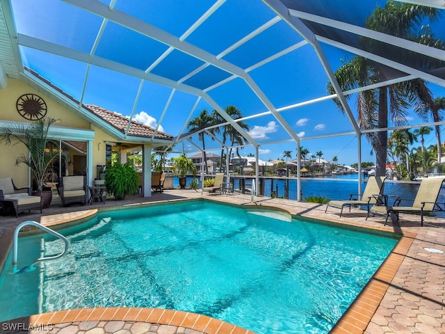 view of swimming pool featuring a patio and a lanai