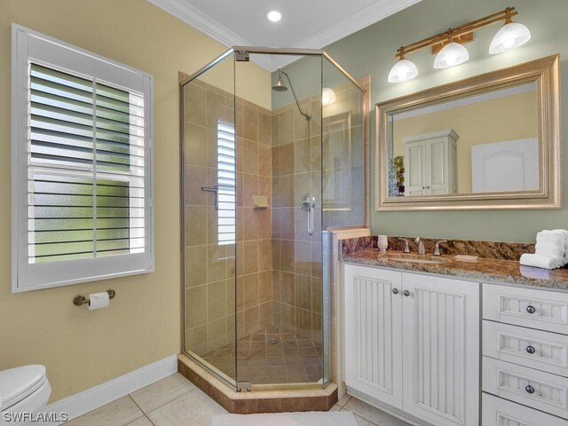 bathroom with vanity, walk in shower, tile flooring, toilet, and crown molding
