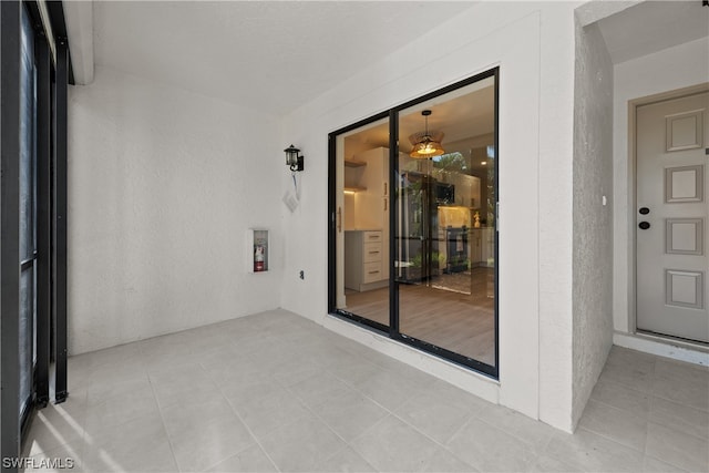 empty room featuring light tile floors