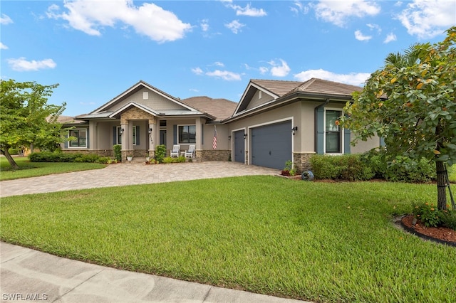 craftsman-style house featuring a front yard and a garage