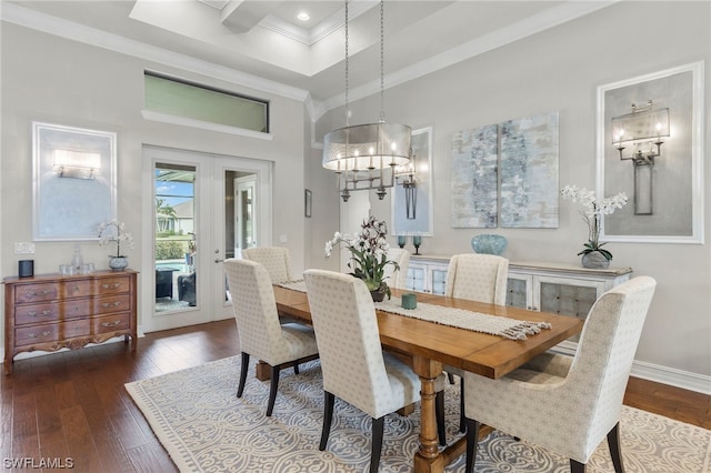 dining room featuring dark hardwood / wood-style flooring, crown molding, and french doors