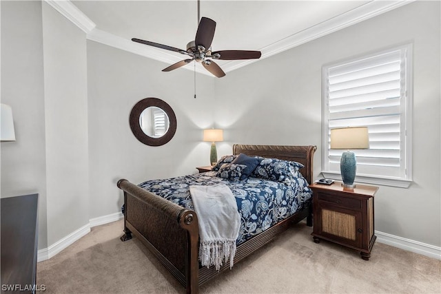 carpeted bedroom with ceiling fan and crown molding