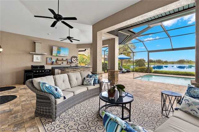 view of patio / terrace featuring a lanai, area for grilling, an outdoor living space, and ceiling fan