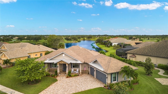 birds eye view of property with a water view