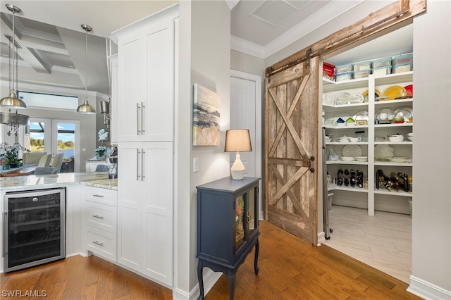 pantry featuring beverage cooler and french doors