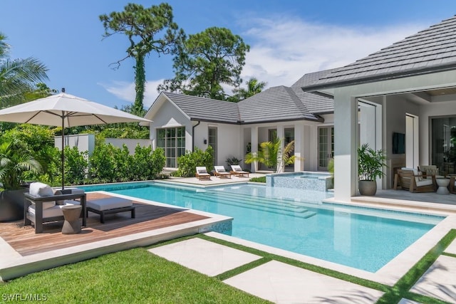 view of swimming pool with an outdoor hangout area, a patio area, and an in ground hot tub