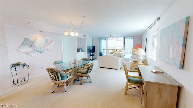 4753 Estero Blvd Unit 1005, Fort Myers Beach, FL 33931 - dining room featuring carpet floors, a chandelier, and ceiling fan