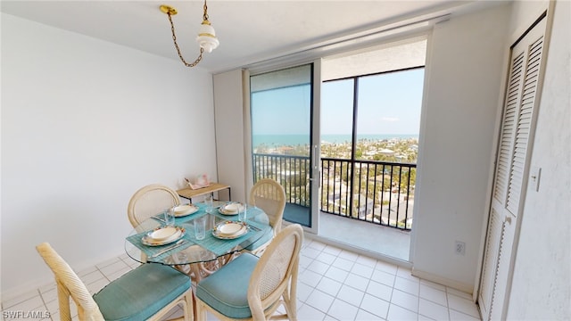 4753 Estero Blvd Unit 1005, Fort Myers Beach, FL 33931 - dining space featuring expansive windows and light tile patterned floors