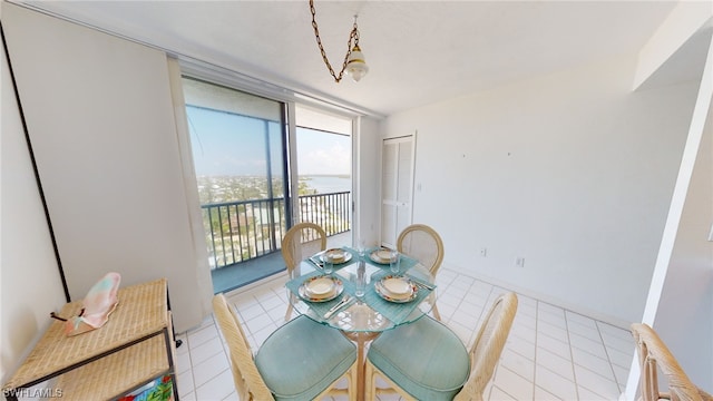 4753 Estero Blvd Unit 1005, Fort Myers Beach, FL 33931 - dining area with tile patterned floors and expansive windows