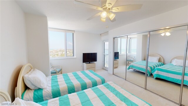 4753 Estero Blvd Unit 1005, Fort Myers Beach, FL 33931 - bedroom with light carpet, a closet, and a ceiling fan