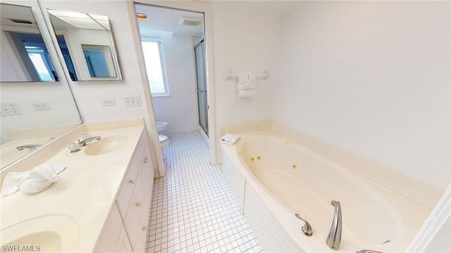 4753 Estero Blvd Unit 1005, Fort Myers Beach, FL 33931 - bathroom featuring toilet, a stall shower, double vanity, a whirlpool tub, and tile patterned floors