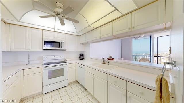 4753 Estero Blvd Unit 1005, Fort Myers Beach, FL 33931 - kitchen featuring white appliances, a sink, light tile patterned floors, light countertops, and ceiling fan