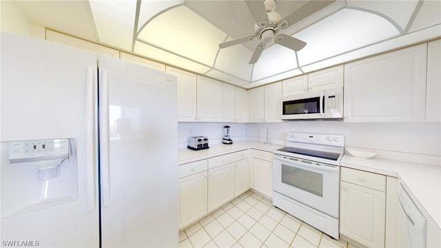 4753 Estero Blvd Unit 1005, Fort Myers Beach, FL 33931 - kitchen featuring white appliances, a ceiling fan, light countertops, white cabinets, and light tile patterned flooring