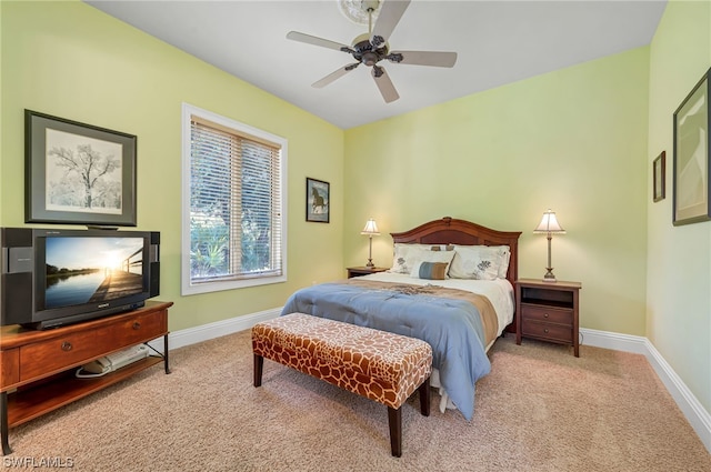 carpeted bedroom with baseboards and a ceiling fan