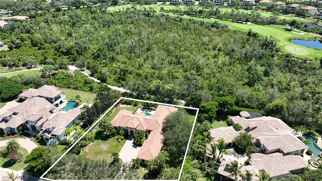 aerial view featuring a residential view, a water view, and view of golf course