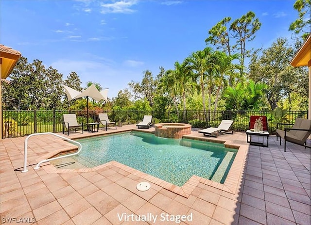 view of pool featuring a patio area, fence, and a pool with connected hot tub