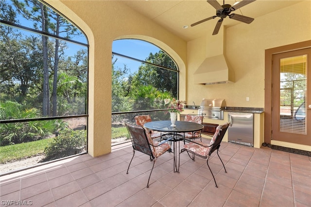 sunroom / solarium with ceiling fan and a healthy amount of sunlight