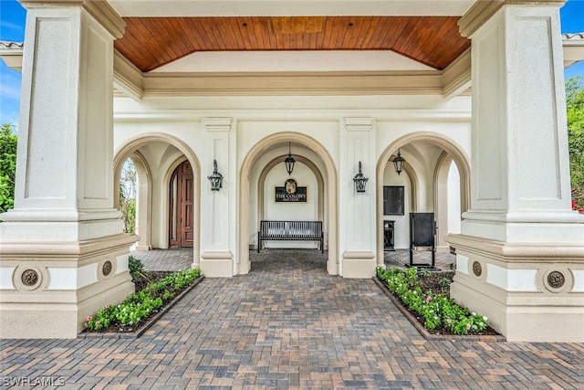 view of exterior entry featuring a porch