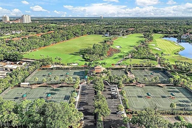 aerial view with a water view and view of golf course