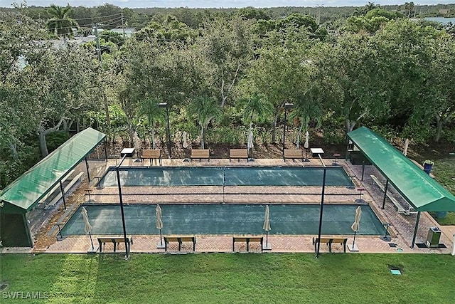 view of swimming pool with a yard