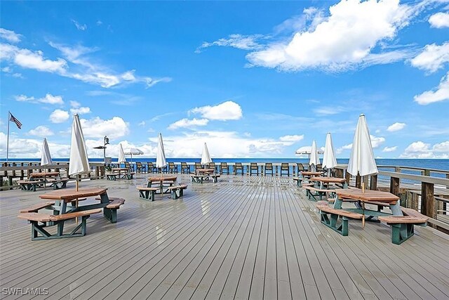 deck featuring a water view and a boat dock