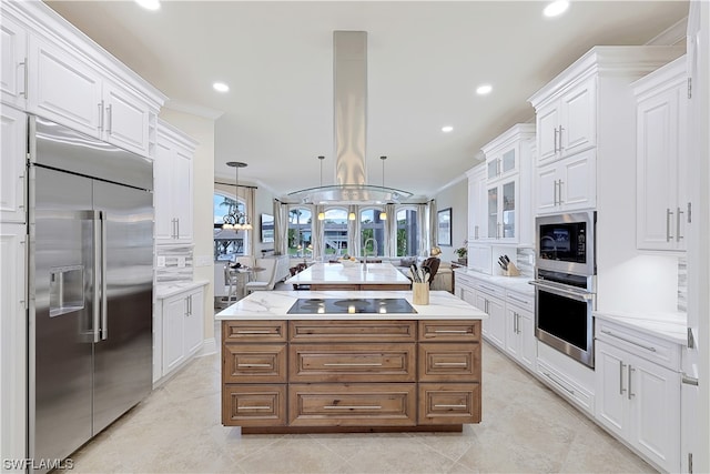 kitchen featuring black appliances, white cabinets, a center island, a chandelier, and island exhaust hood