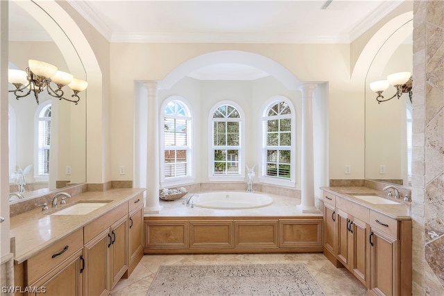 bathroom with a bathing tub, tile flooring, decorative columns, and ornamental molding