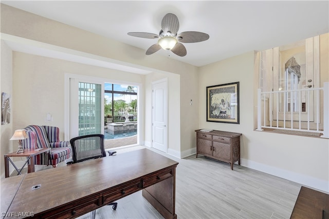 office with ceiling fan and light wood-type flooring