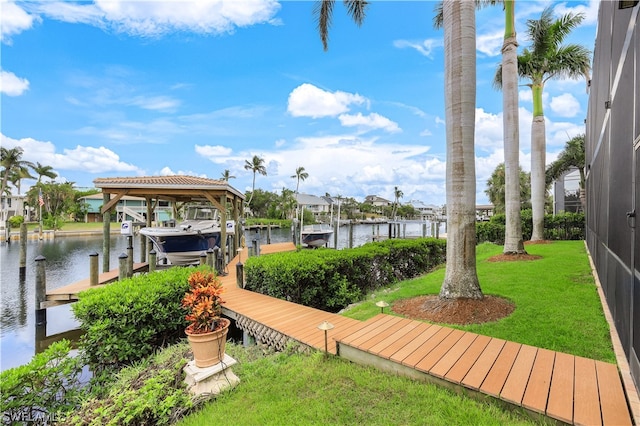 exterior space featuring a water view and a lawn