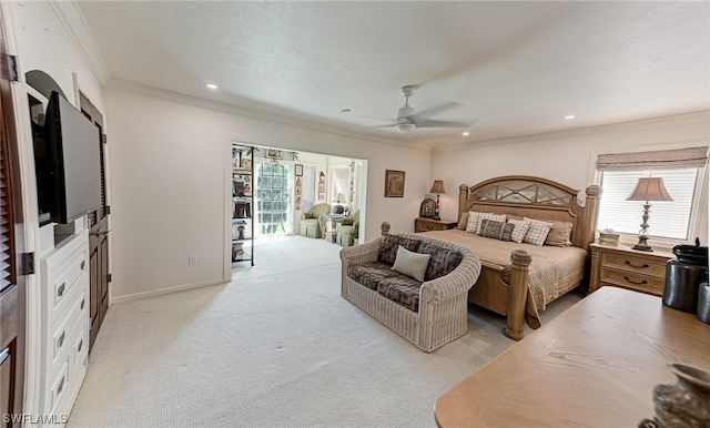 bedroom featuring ornamental molding, access to outside, ceiling fan, and light colored carpet