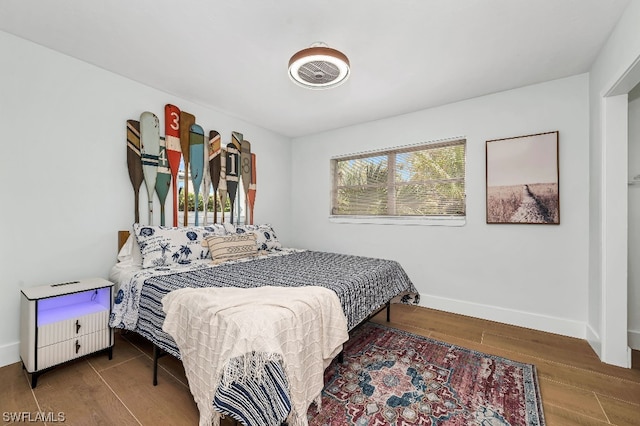 bedroom featuring dark hardwood / wood-style flooring