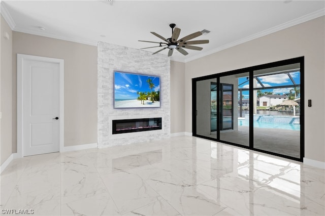 unfurnished living room with a fireplace, ceiling fan, and crown molding