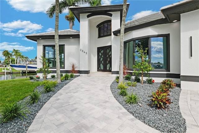 entrance to property with a water view