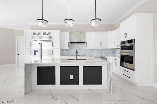 kitchen with white cabinetry, light stone countertops, decorative light fixtures, a kitchen island with sink, and appliances with stainless steel finishes