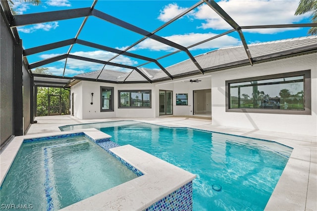 view of pool with ceiling fan, a lanai, a patio, and an in ground hot tub