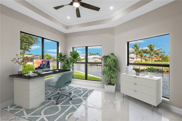 office area featuring ceiling fan, a water view, ornamental molding, and a wealth of natural light