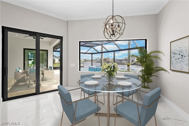 dining space featuring crown molding and a notable chandelier