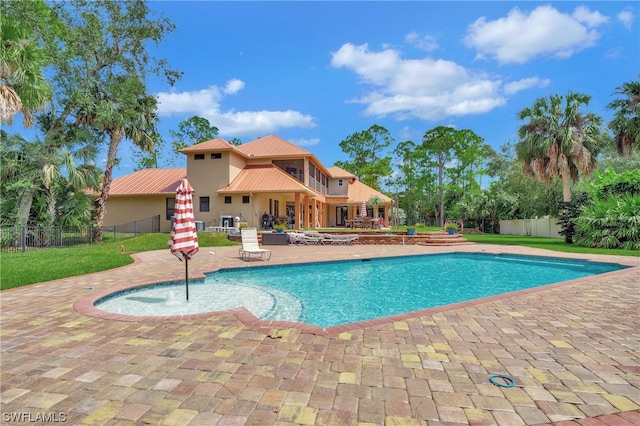 view of swimming pool featuring a patio