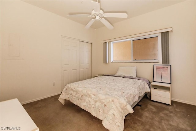 carpeted bedroom featuring ceiling fan and a closet