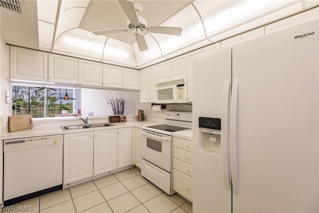 kitchen with sink, white cabinets, light tile patterned floors, ceiling fan, and white appliances