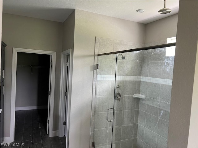 bathroom with a shower with shower door