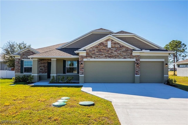 view of front of house featuring a garage, a porch, and a front yard