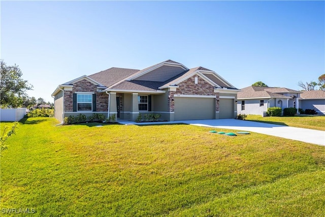 view of front of house featuring a garage and a front yard