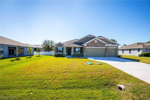 ranch-style home featuring a garage and a front lawn