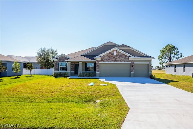 view of front of house featuring a garage and a front yard