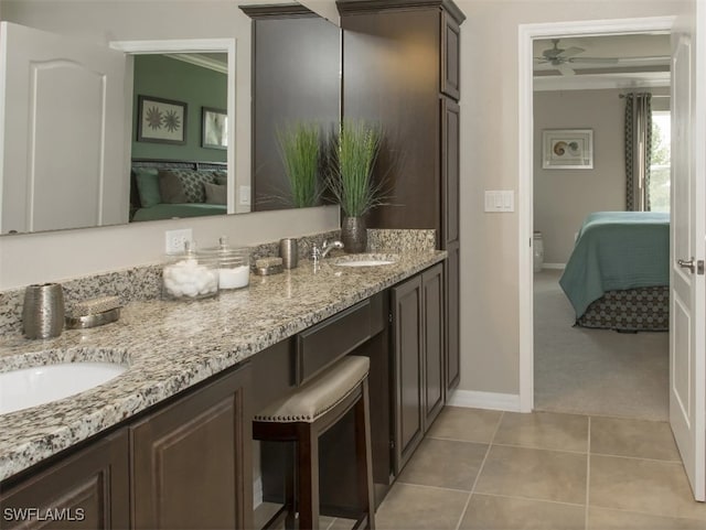 bathroom featuring ceiling fan, tile patterned floors, and vanity